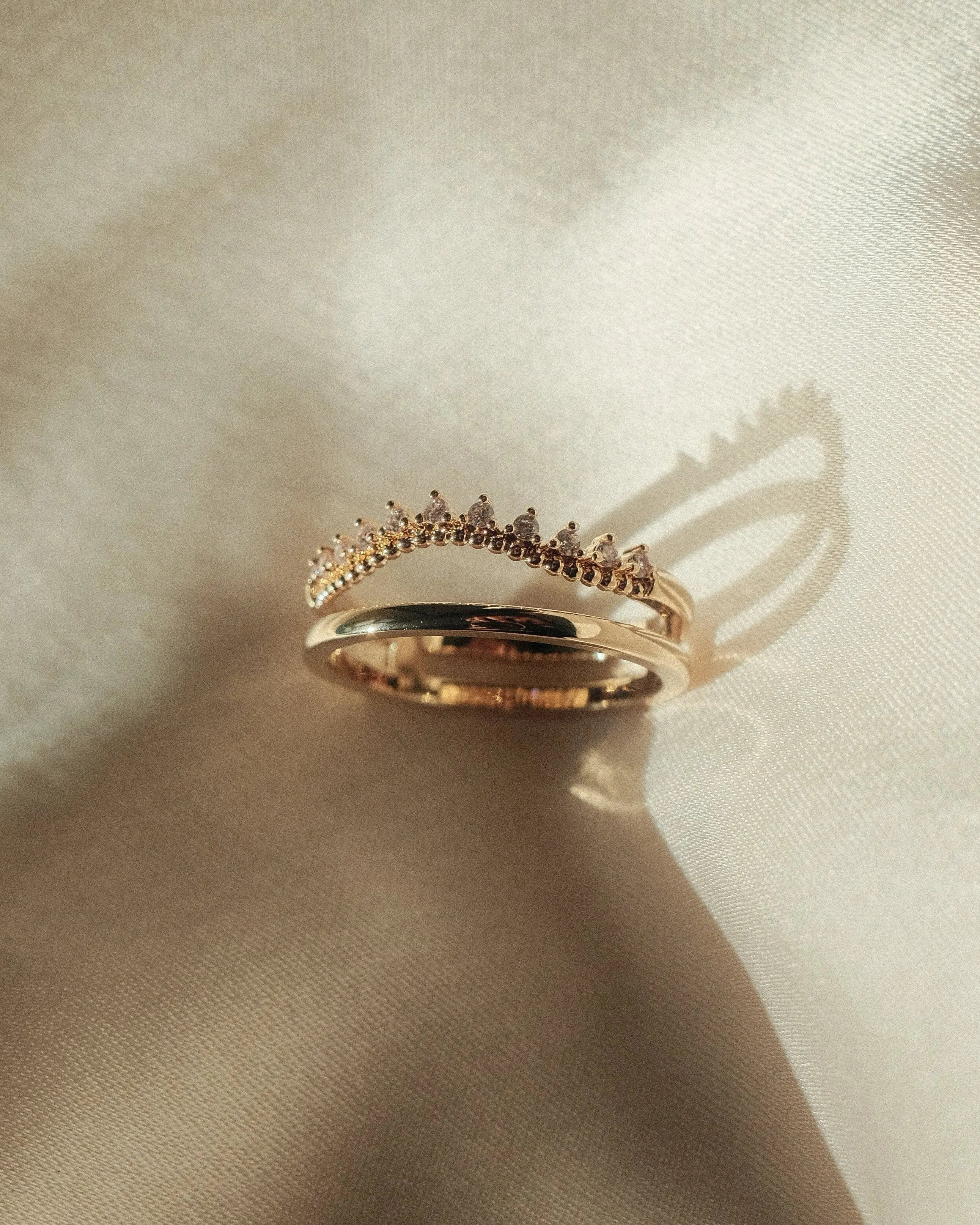 Flat lay of Amelia Ring on neutral textured fabric – IGGI Jewellery