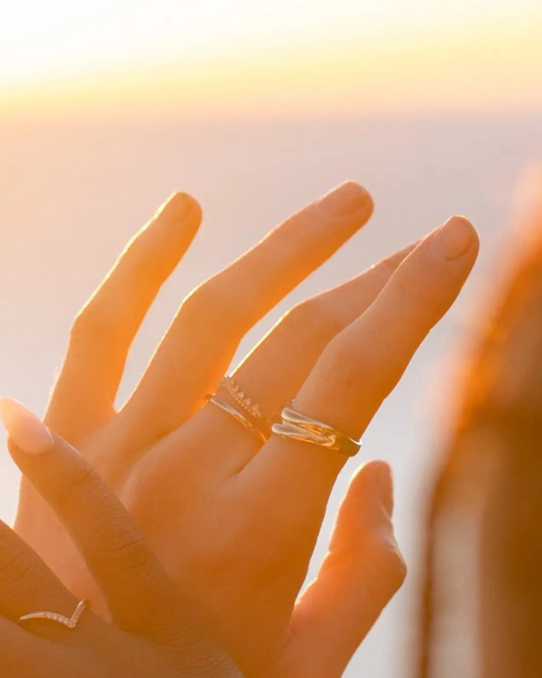 Amelia Ring styled on hand with warm sunlight – IGGI Jewellery