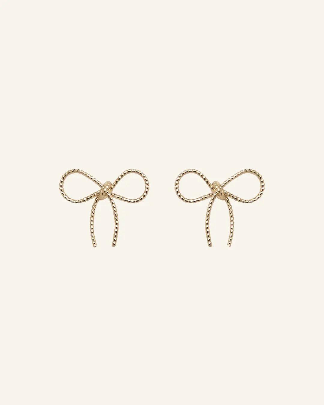 Bow Stud Earrings in 18k gold-filled finish by IGGI Jewellery – delicate bow design, hypoallergenic and tarnish-resistant.