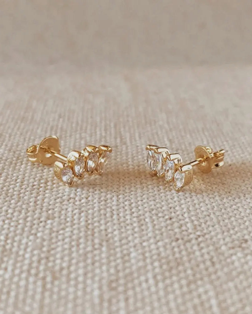 Cluster Curved Stud Earrings in 18k gold-filled displayed on soft fabric