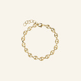 18k gold-filled Coffee Bean Bracelet by IGGI Jewellery on neutral background