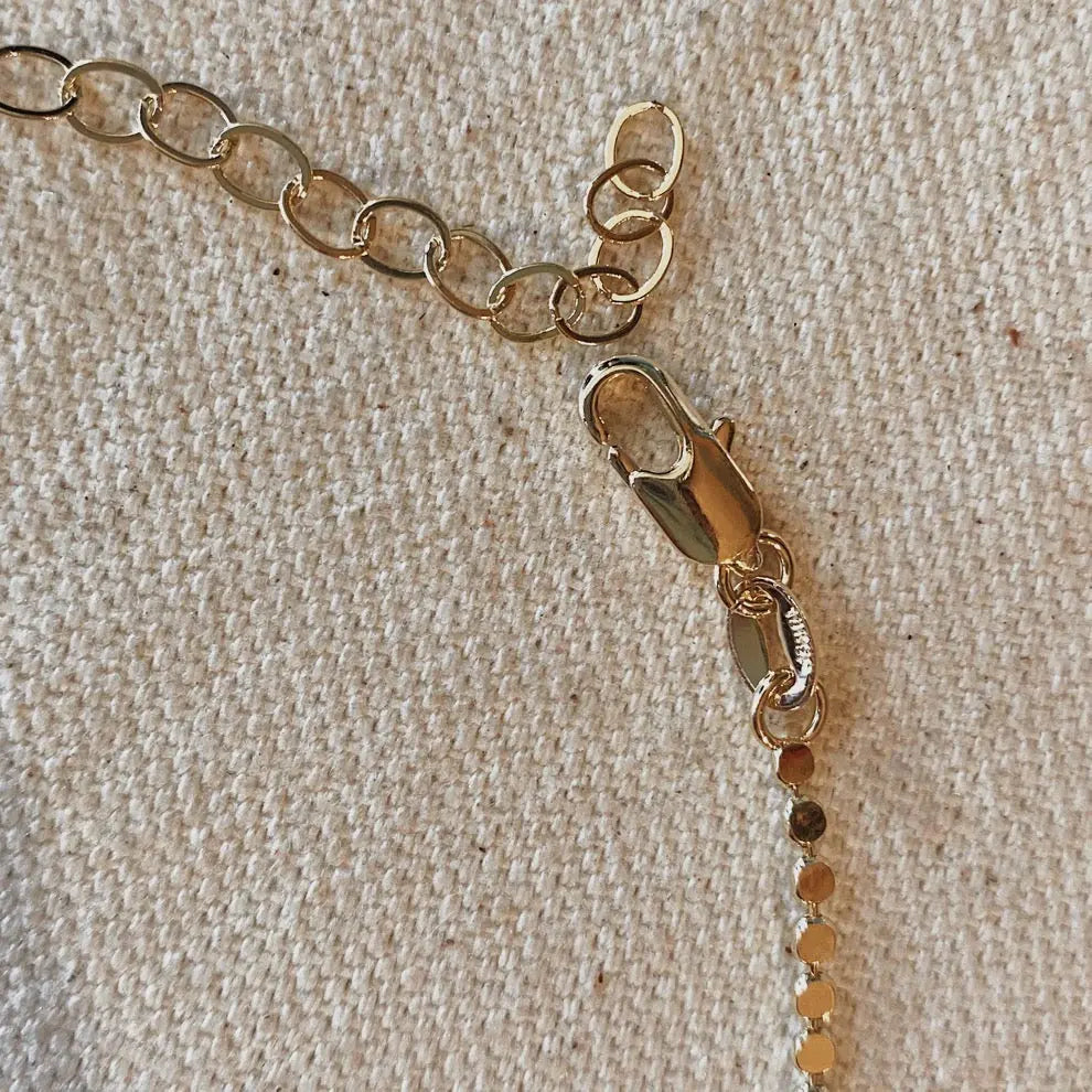 Close-up of Dotted Chain Necklace in 18k gold-filled showing clasp and extender detail on linen backdrop