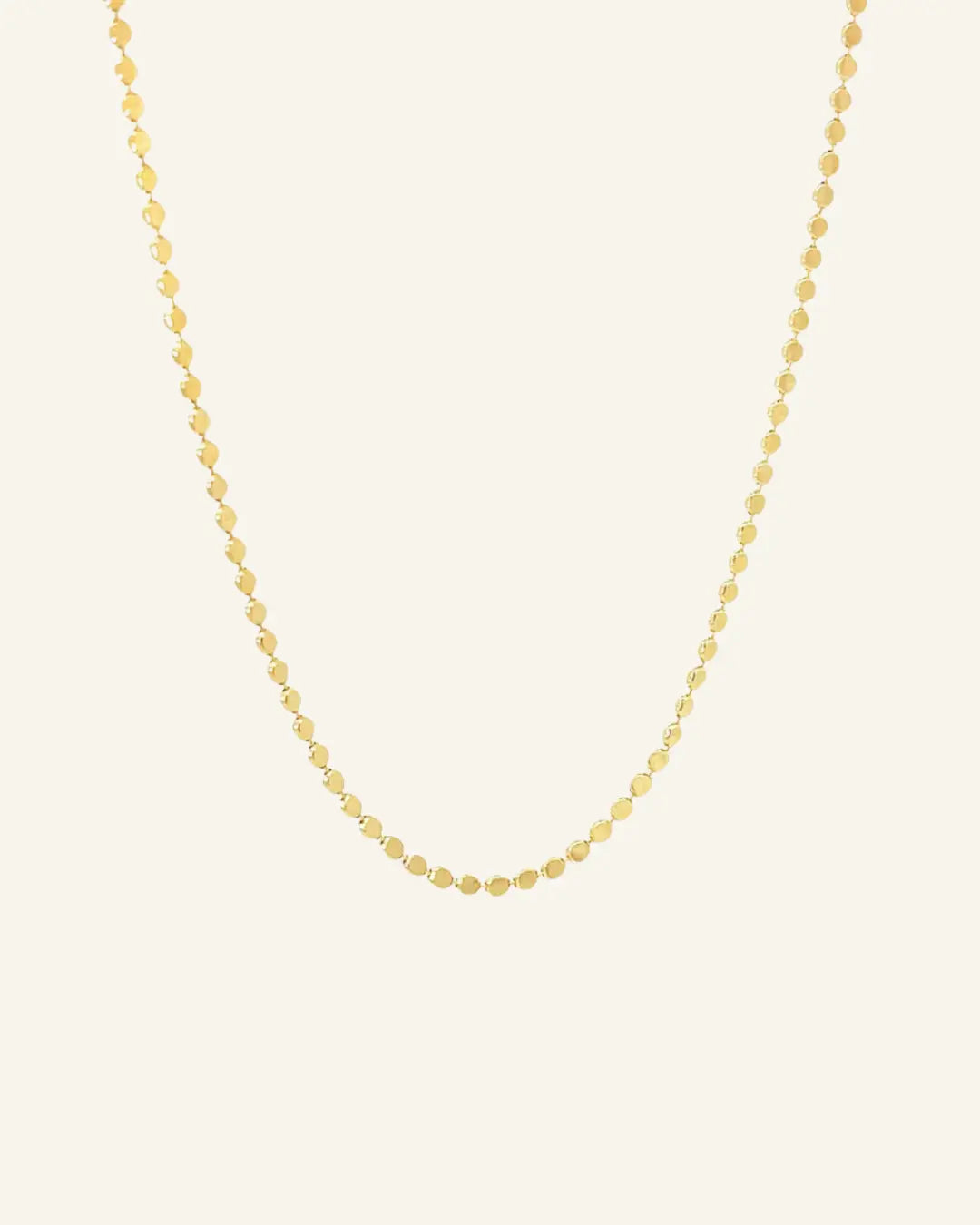 Dotted Chain Necklace in 18k gold-filled shown on a neutral background in flatlay view