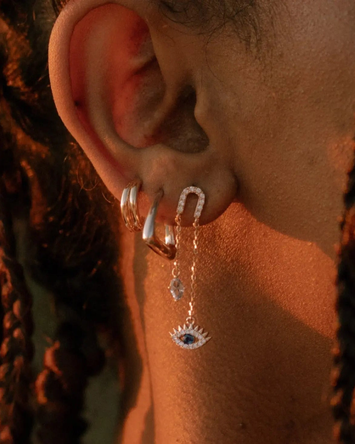 Double Huggie Hoops in 18k gold-filled styled on model in an ear stack by IGGI Jewellery