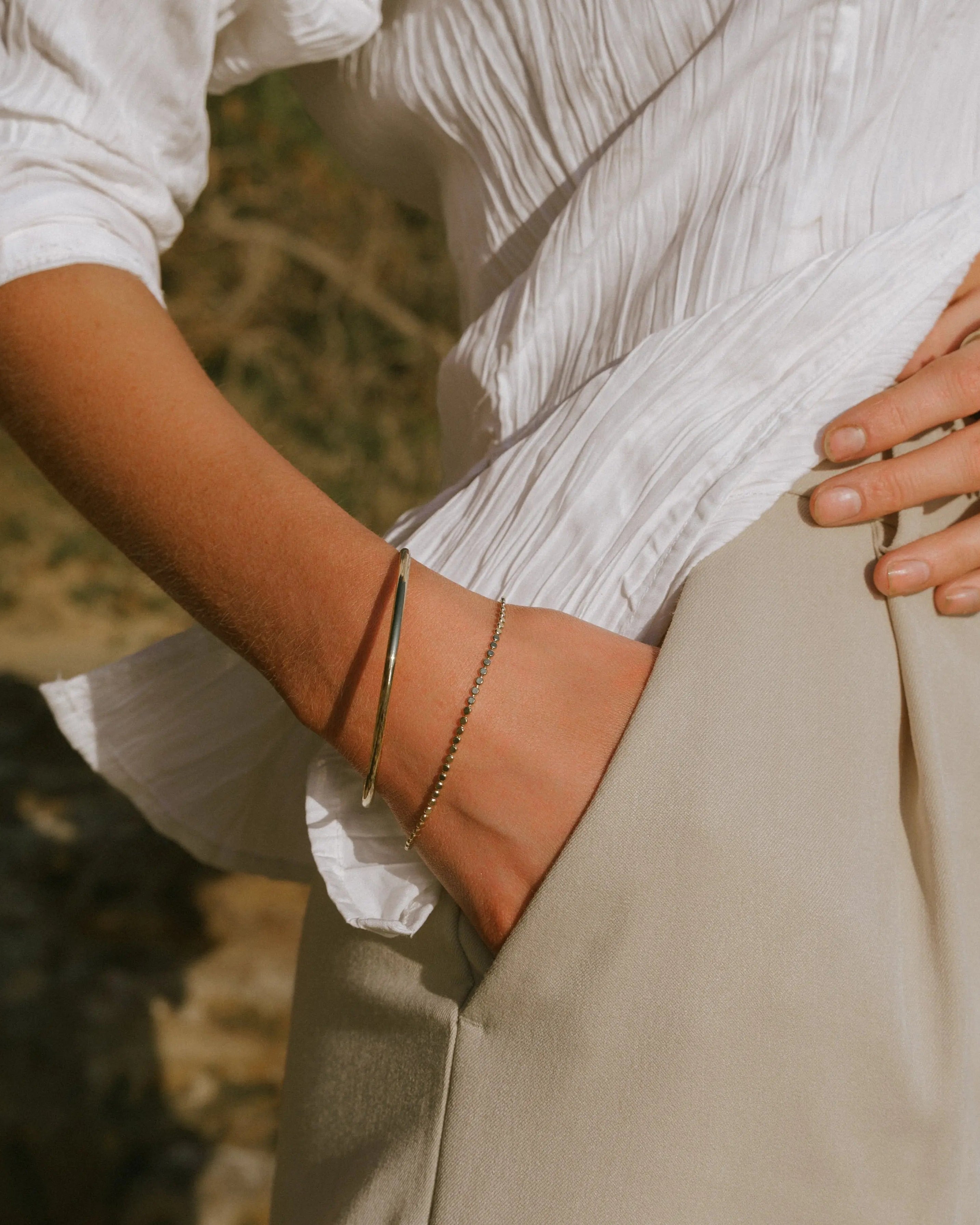 Fine Gold Bangle styled on wrist, IGGI Jewellery everyday gold bracelet