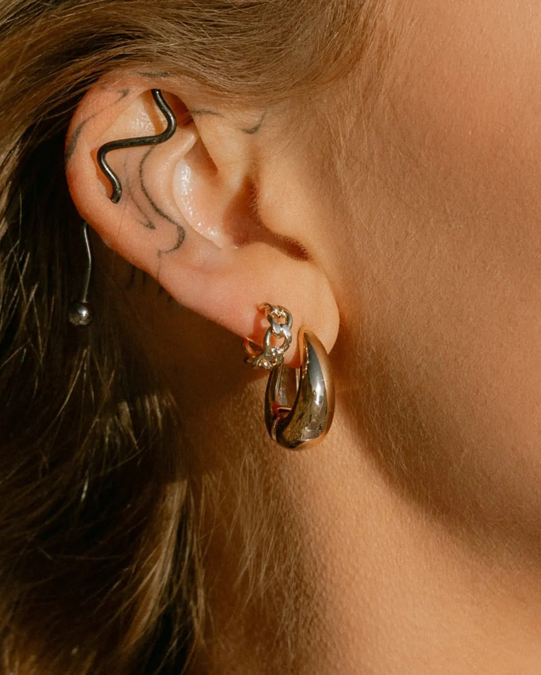 Model wearing Mona Drop Hoops - IGGI Jewellery 18k Gold-Filled Earrings