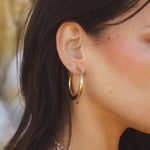 Side view of Rue Hoops - 18k Gold-Filled Hoop Earrings by IGGI Jewellery