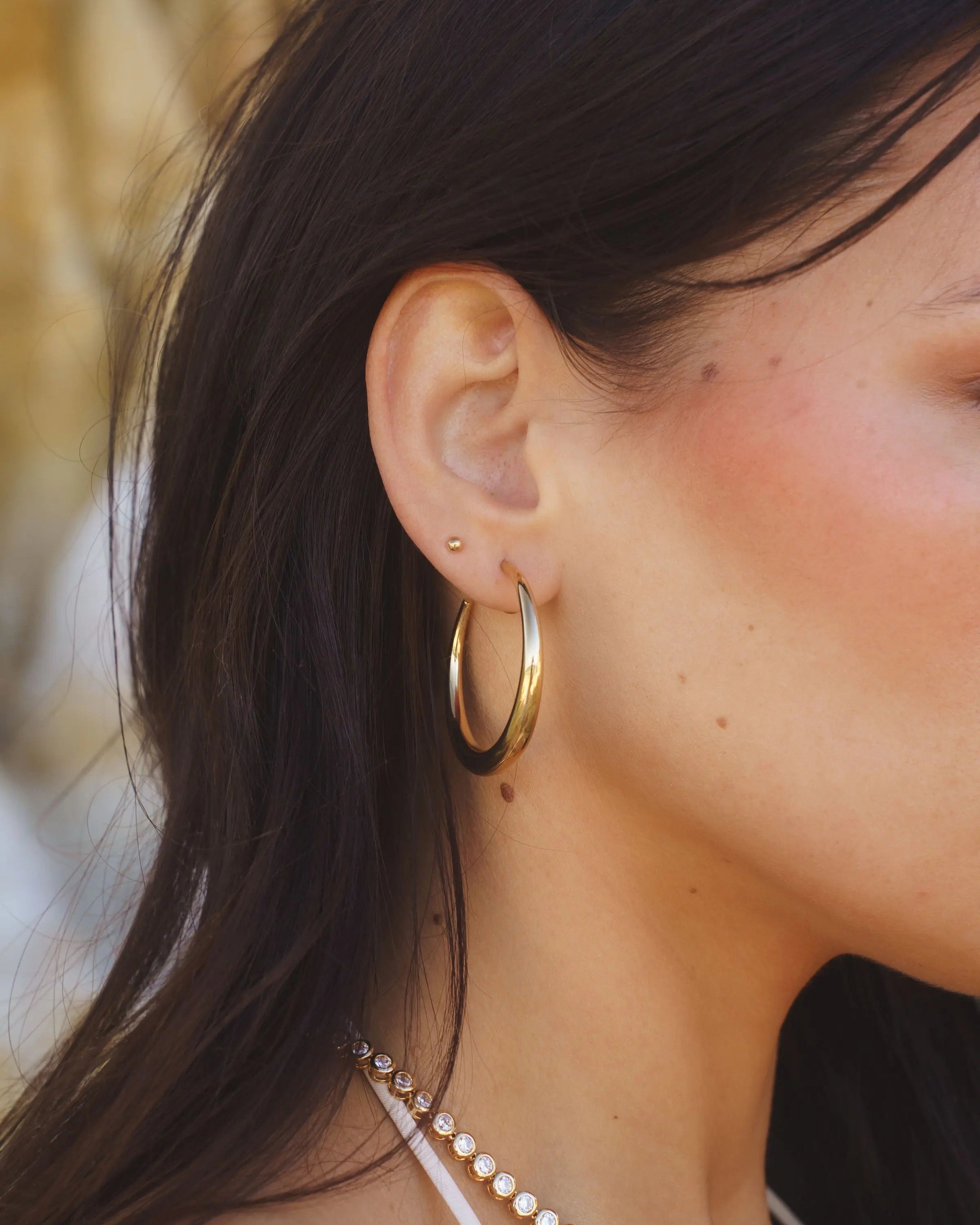 Side view of Rue Hoops - 18k Gold-Filled Hoop Earrings by IGGI Jewellery
