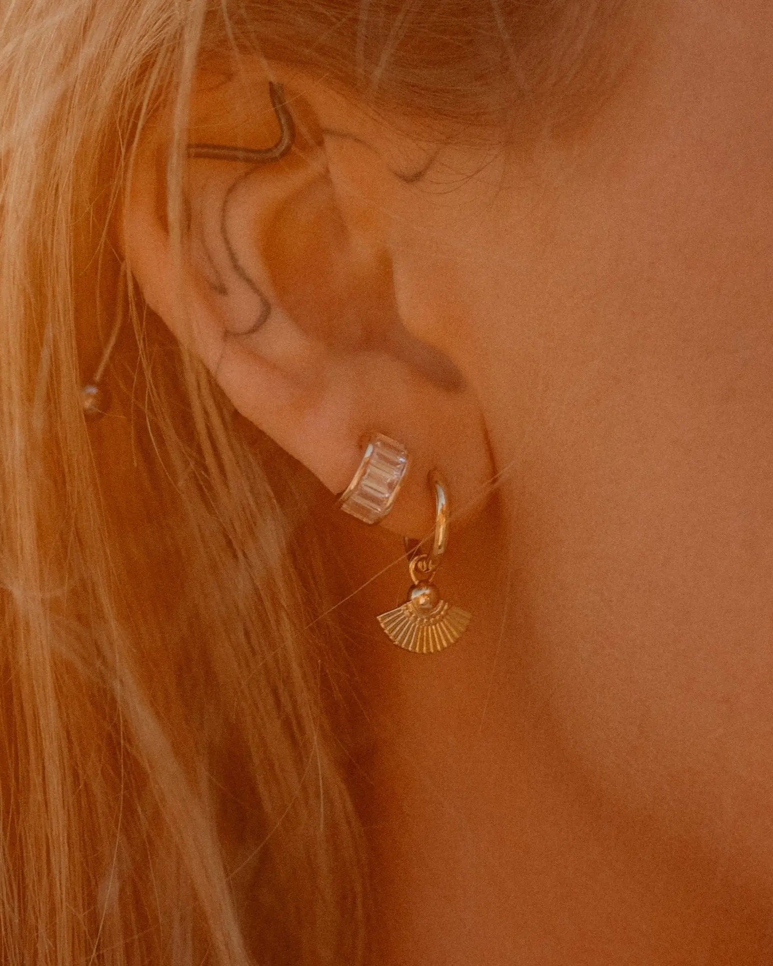 Sonia Studs 18k gold-filled hoop earrings worn on ear, styled with other IGGI Jewellery pieces