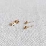 Everyday Ball Studs styled with additional earrings on model’s ear