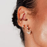 Bella C Hoop Studs styled on ear – 18k gold-filled with CZ stone