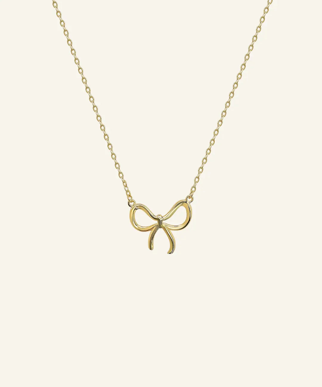 Close-up of bow pendant necklace in 18k gold filled