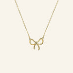 Close-up of bow pendant necklace in 18k gold filled