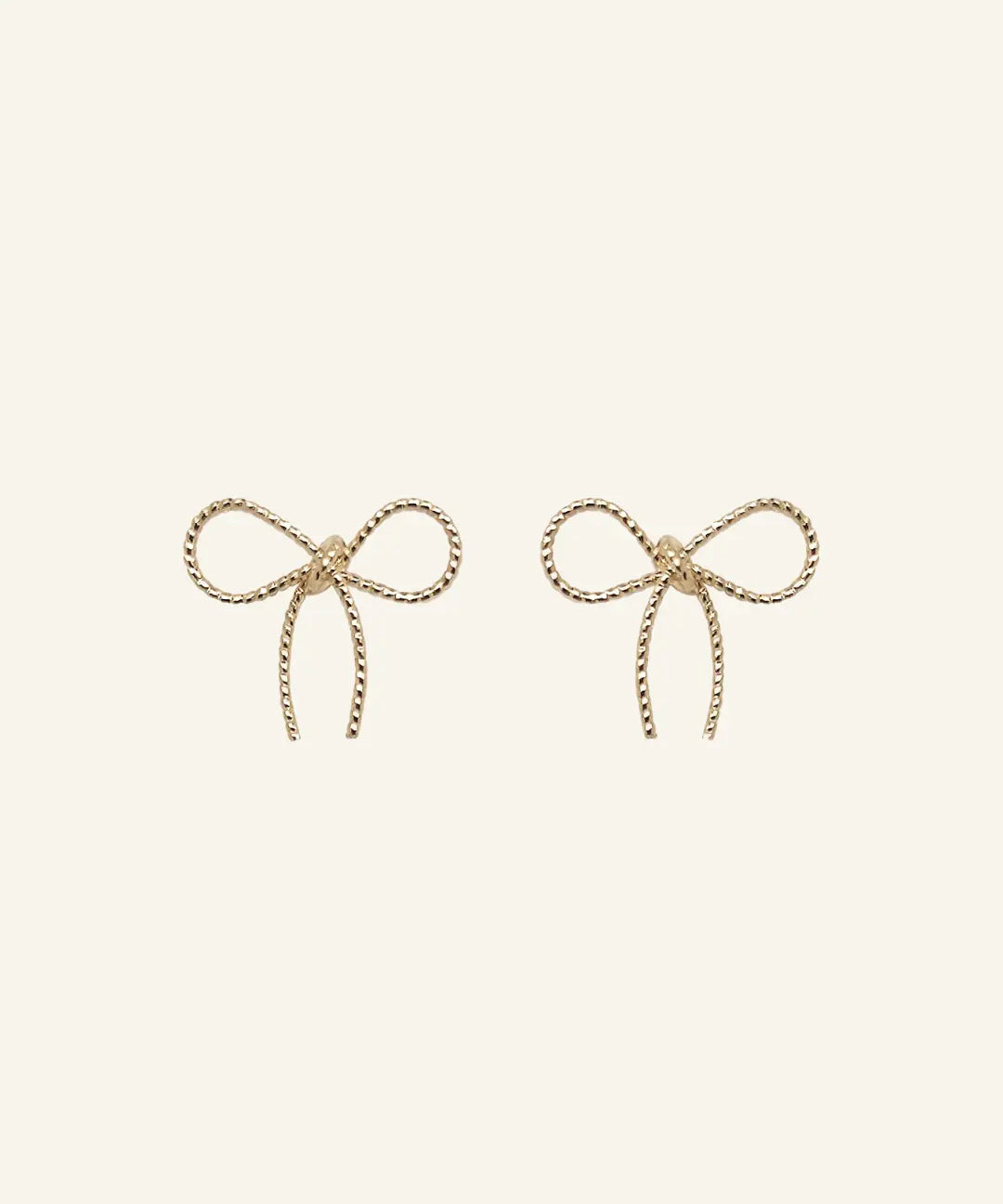 Bow Stud Earrings in 18k gold-filled finish by IGGI Jewellery – delicate bow design, hypoallergenic and tarnish-resistant.