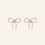 Bow Stud Earrings in 18k gold-filled finish by IGGI Jewellery – delicate bow design, hypoallergenic and tarnish-resistant.