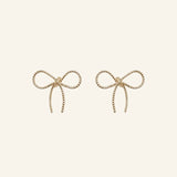 Bow Stud Earrings in 18k gold-filled finish by IGGI Jewellery – delicate bow design, hypoallergenic and tarnish-resistant.