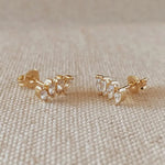 Cluster Curved Stud Earrings in 18k gold-filled displayed on soft fabric