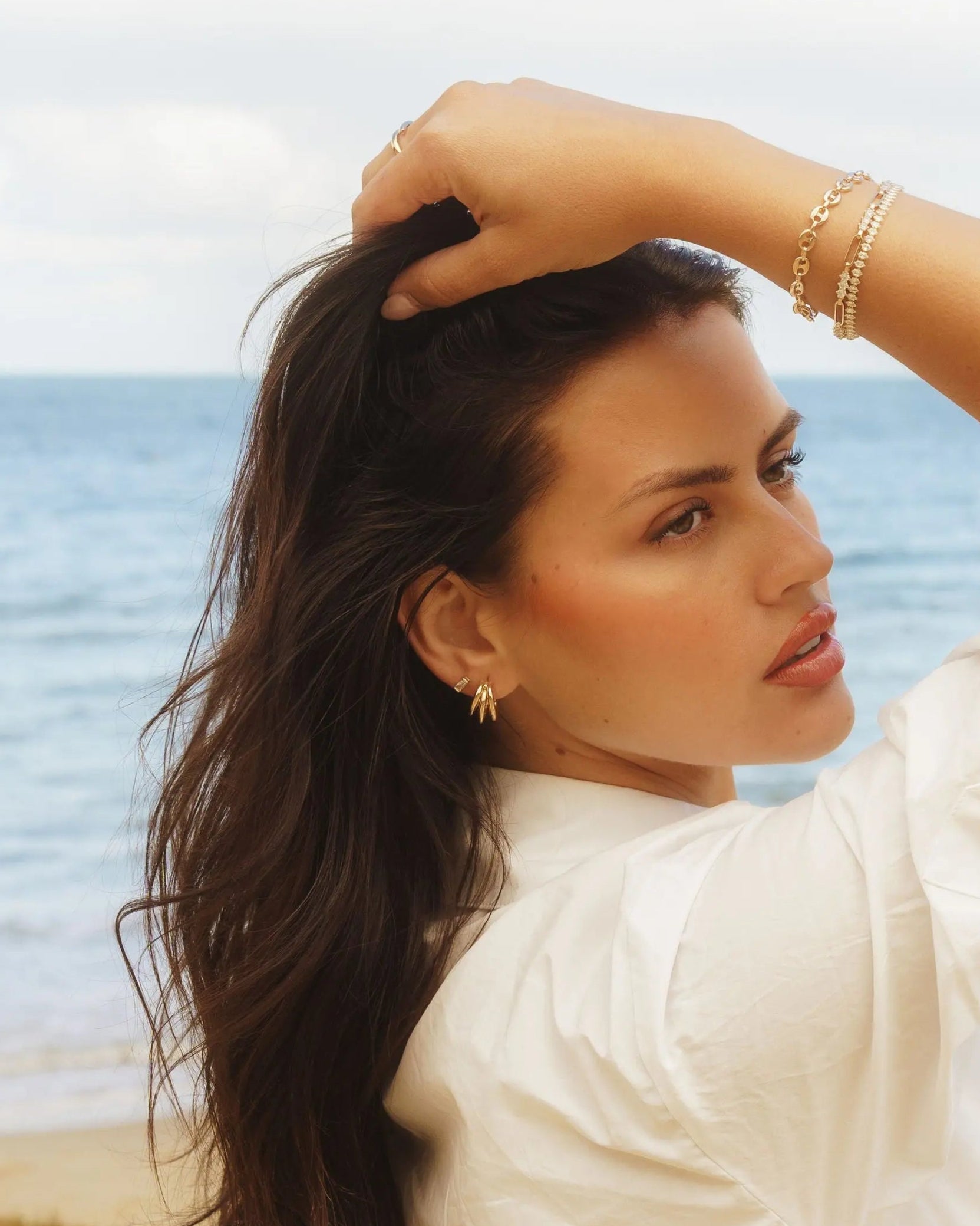 Cove Drop Earrings styled on ear - IGGI Jewellery