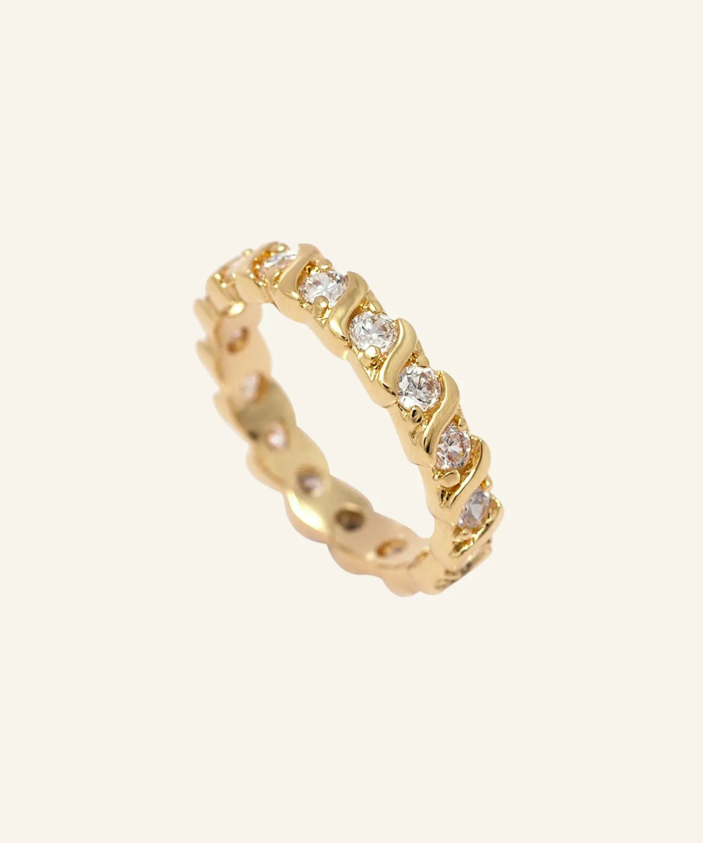 Donella Ring – 18k gold-filled band with CZ stones on neutral background