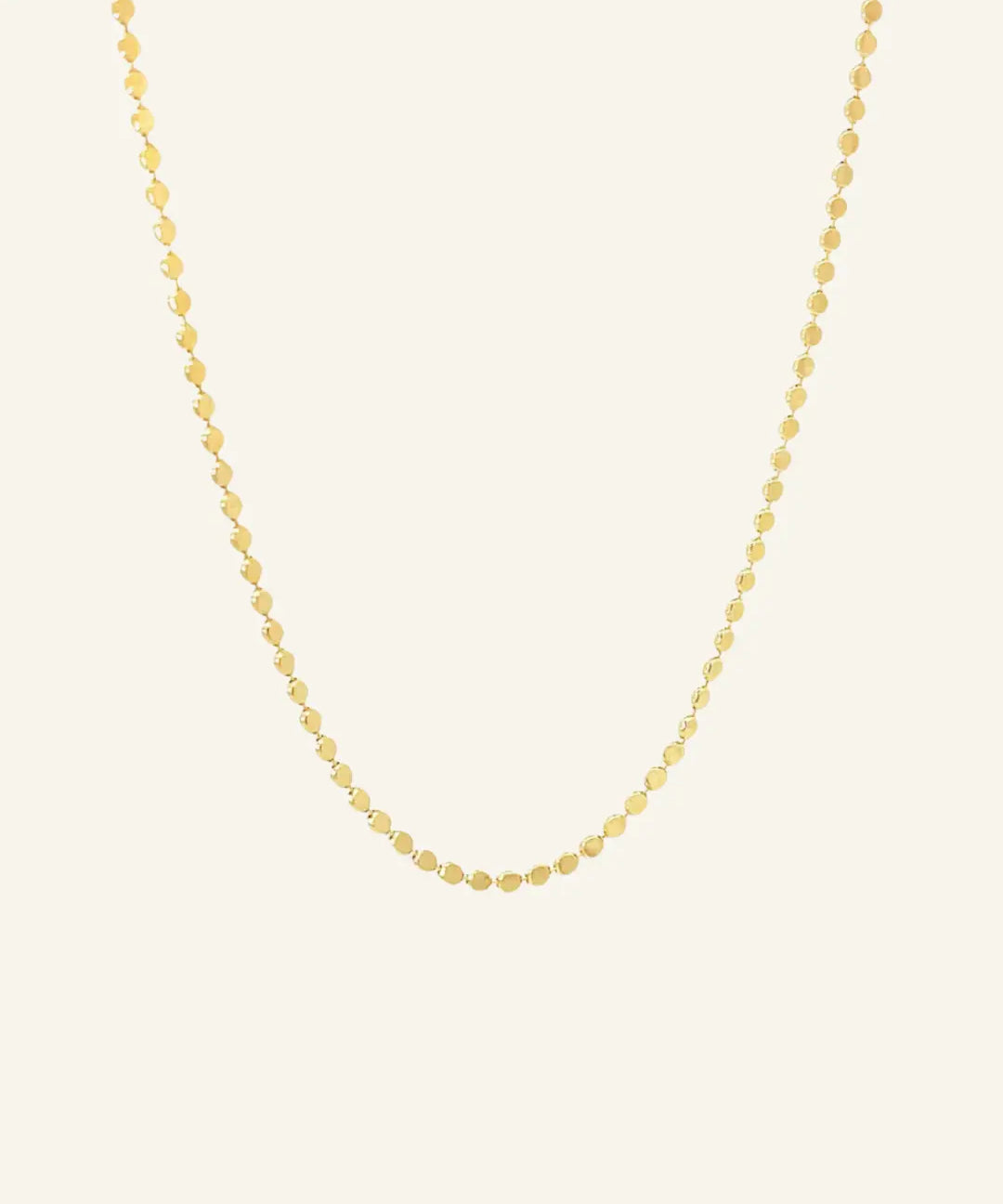 Dotted Chain Necklace in 18k gold-filled shown on a neutral background in flatlay view