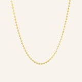 Dotted Chain Necklace in 18k gold-filled shown on a neutral background in flatlay view