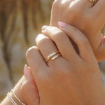 Etta Ring styled on hand with layered IGGI Jewellery rings.