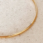 Close-up of Fine Gold Bangle - 18k gold-filled bracelet by IGGI Jewellery