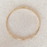 Fine Gold Bangle flat lay - gold-filled minimal bracelet by IGGI Jewellery
