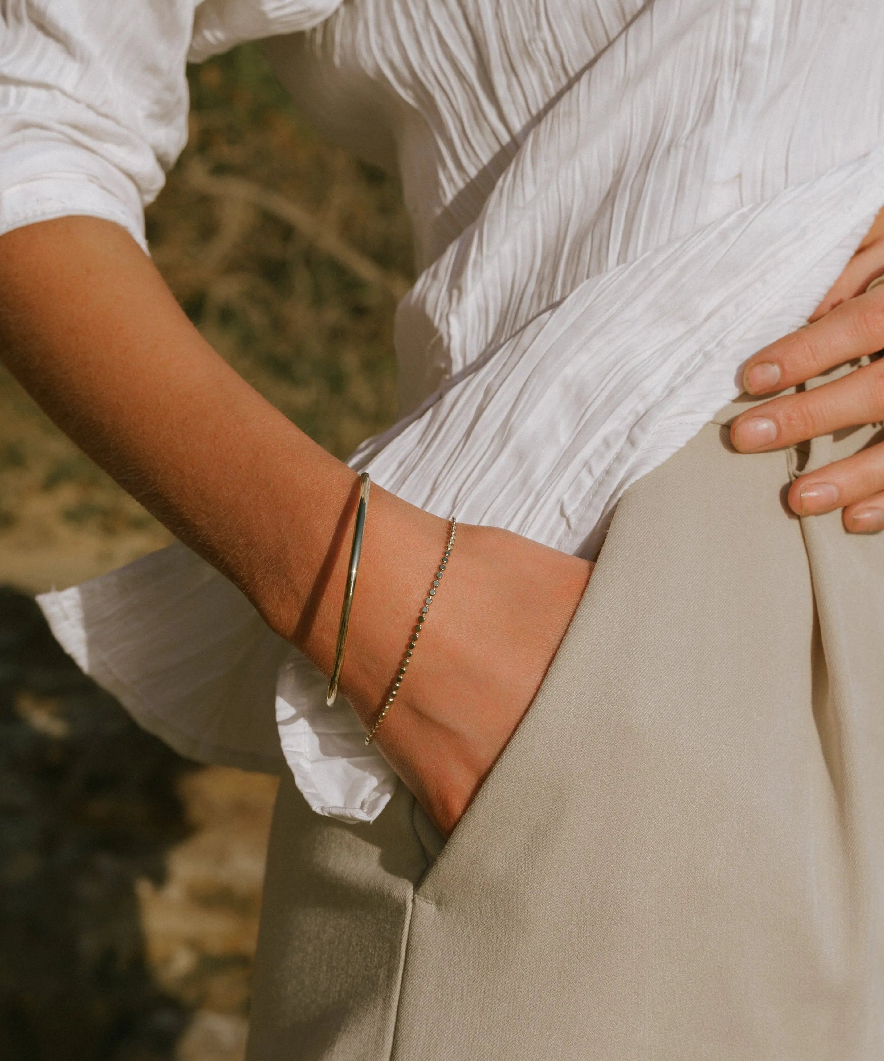 Fine Gold Bangle styled on wrist, IGGI Jewellery everyday gold bracelet