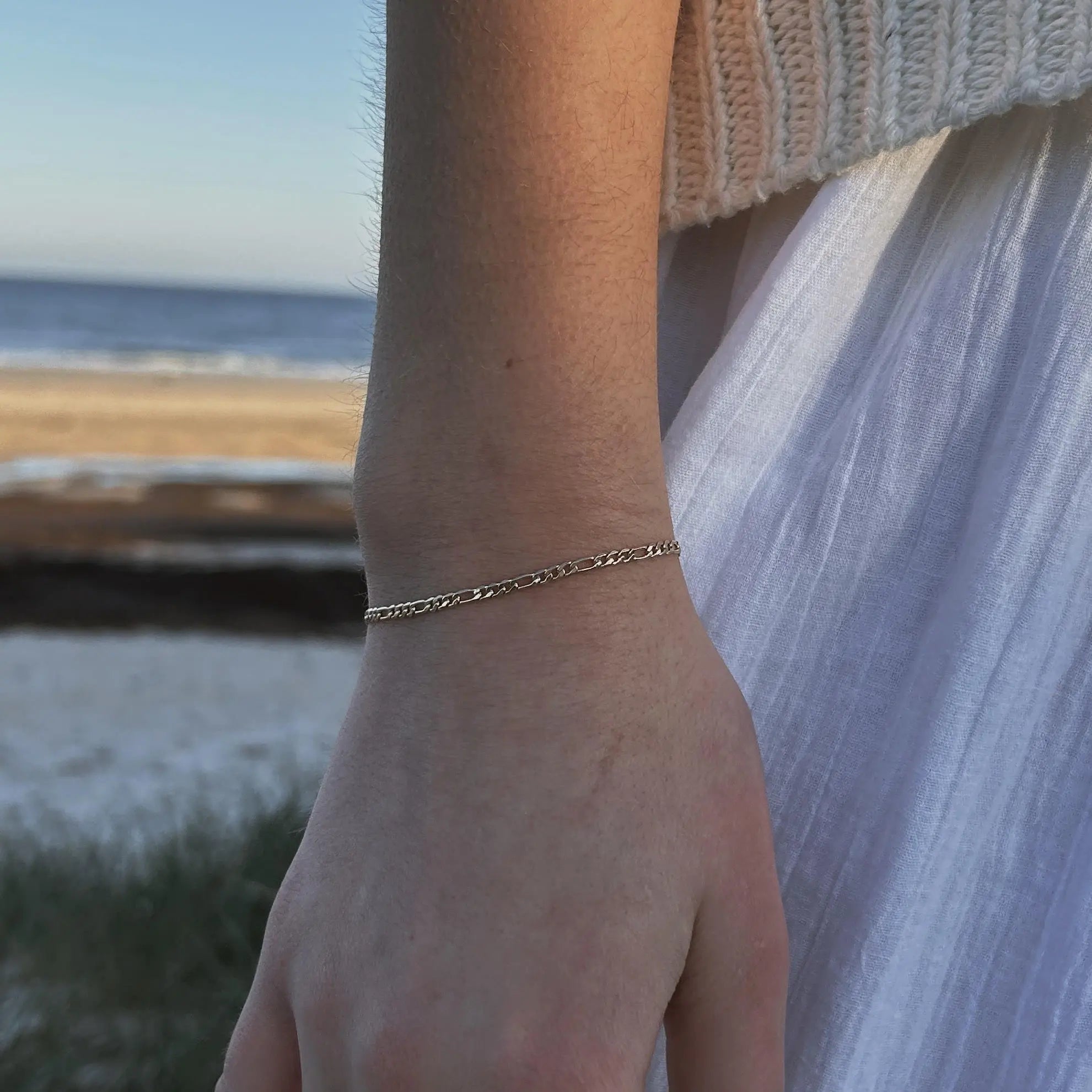 Close-up of Flat Figaro Chain Bracelet in gold-filled finish for IGGI Jewellery.