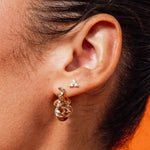 Model wearing Gold Tri CZ Stud Earrings with cubic zirconia stones by IGGI Jewellery