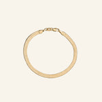 Herringbone Chain Bracelet 4mm in 18k gold-filled, flat interlocking links with a smooth liquid-gold finish, designed by IGGI Jewellery.