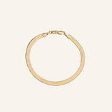 Herringbone Chain Bracelet 4mm in 18k gold-filled, flat interlocking links with a smooth liquid-gold finish, designed by IGGI Jewellery.