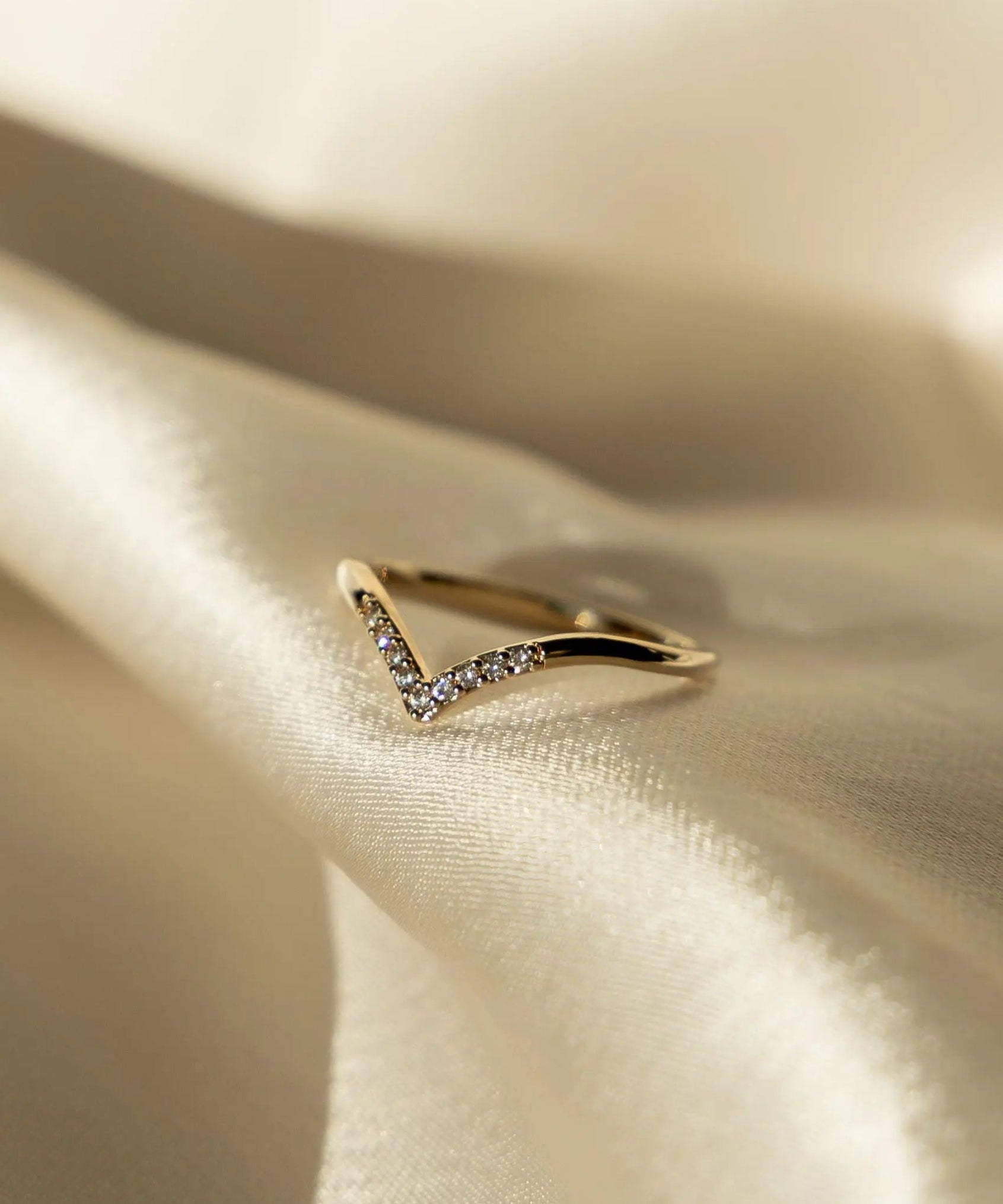Lexi Ring styled on hand with sunlight highlighting the details