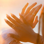 Lexi Ring stacked with other IGGI gold rings for a layered look
