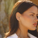 Mini Mona Hoops styled on model with layered necklaces by IGGI Jewellery