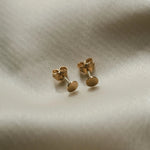 Round Disc Studs displayed on soft fabric for IGGI Jewellery product detail