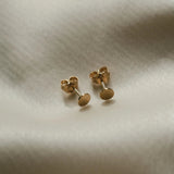 Round Disc Studs displayed on soft fabric for IGGI Jewellery product detail