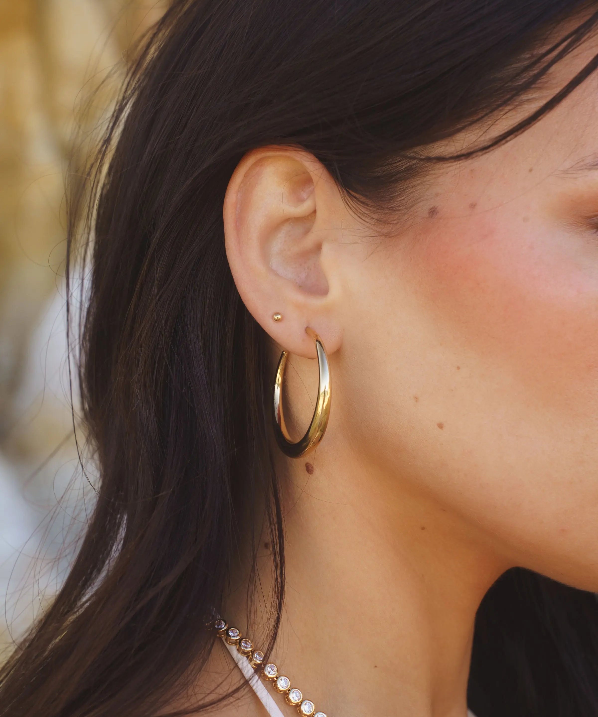 Side view of Rue Hoops - 18k Gold-Filled Hoop Earrings by IGGI Jewellery