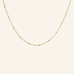 Satellite Ball Chain Necklace flatlay showing 18k gold-filled chain with dainty satellite beads