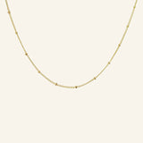 Satellite Ball Chain Necklace flatlay showing 18k gold-filled chain with dainty satellite beads