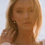 Sonia Studs 18k gold-filled earrings worn by model outdoors in warm sunlight