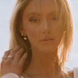 Sonia Studs 18k gold-filled earrings worn by model outdoors in warm sunlight