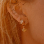 Sonia Studs 18k gold-filled hoop earrings worn on ear, styled with other IGGI Jewellery pieces