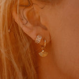 Sonia Studs 18k gold-filled hoop earrings worn on ear, styled with other IGGI Jewellery pieces