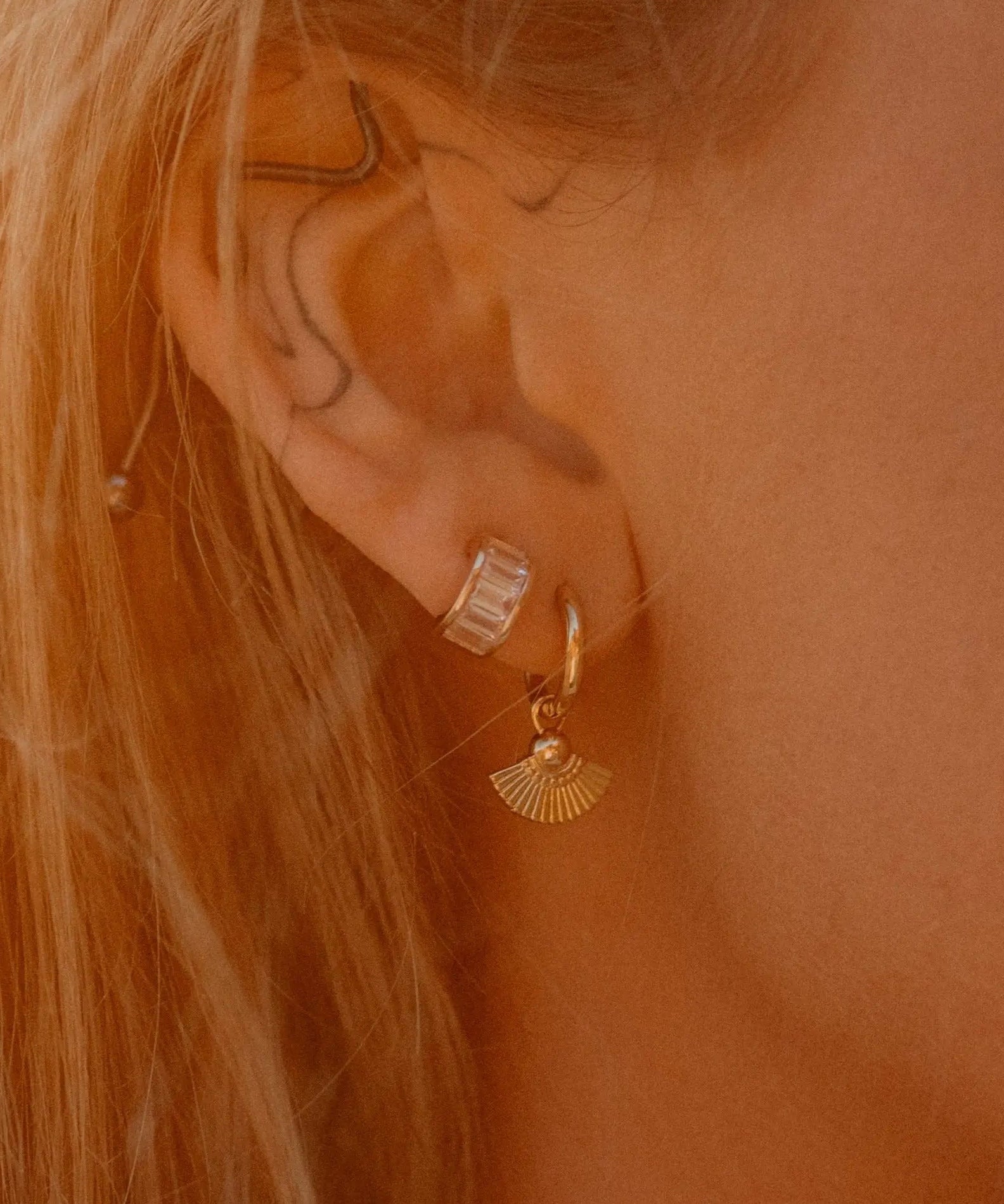 Sonia Studs 18k gold-filled hoop earrings worn on ear, styled with other IGGI Jewellery pieces