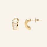 Sonia Studs 18k gold-filled hoop earrings with baguette CZ stones on neutral background