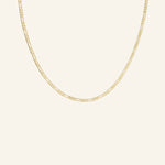 Thin Flat Figaro Chain Necklace in 18k gold-filled displayed flat on neutral background