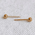 Everyday Ball Stud Earrings – flat lay on neutral fabric background