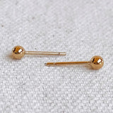 Everyday Ball Stud Earrings – flat lay on neutral fabric background